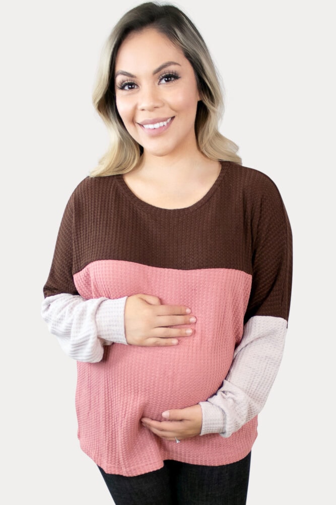 Fun, and cozy, this waffle knit maternity top is sure to keep you comfy.